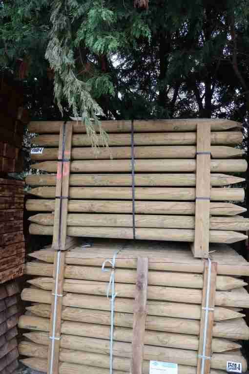 round posts wooden - side view stacked - tamrec and croft fencing and gates ltd 01787 224848