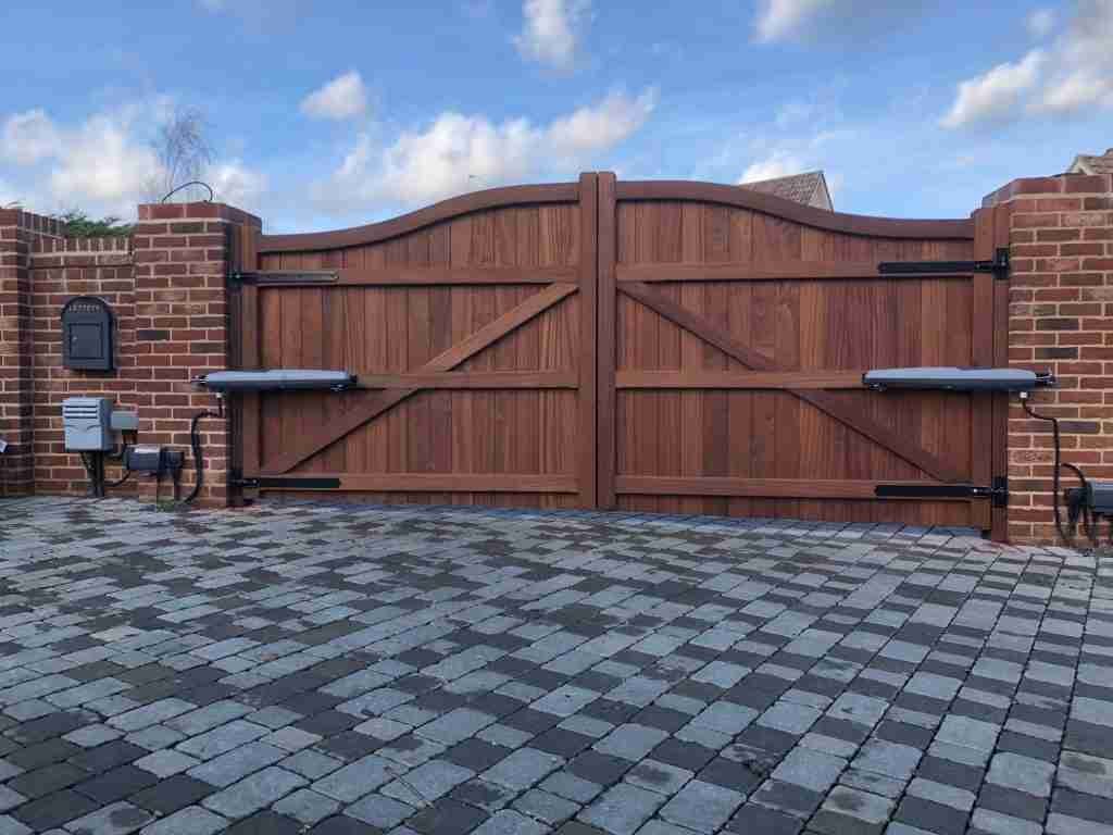 Rear view of hardwood Bow Tops with automation Tarmec and Croft Fencing and Gates